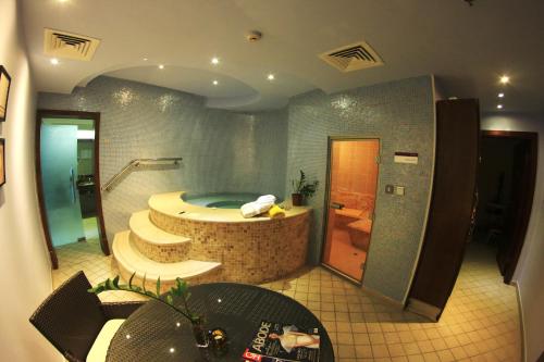 A bathroom at Grand Regal Hotel
