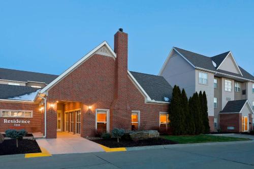 a house in a residential neighborhood at dusk at Residence Inn Canton in North Canton