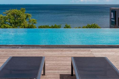 a swimming pool with a view of the ocean at Sopot Marriott Resort & Spa in Sopot