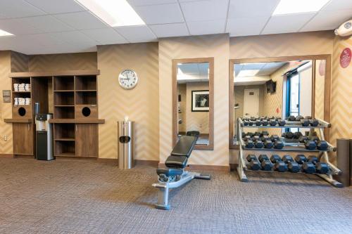 a gym room with a chair and a mirror at Residence Inn by Marriott Akron South/Green in Akron