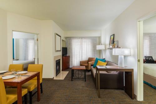a living room with a couch and a table at Residence Inn Chattanooga Downtown in Chattanooga