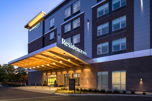 a hotel building with a sign on the front of it at Residence Inn by Marriott Boston Natick in Natick