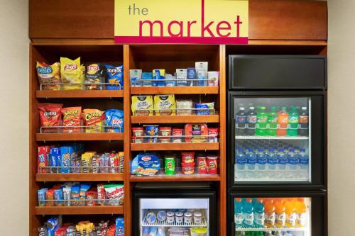 a store with a refrigerator with drinks and drinks at Residence Inn by Marriott Chicago / Bloomingdale in Bloomingdale