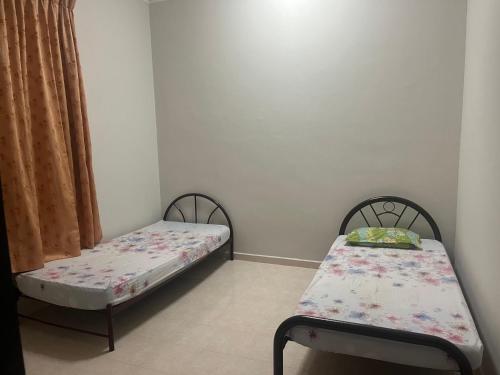Postel nebo postele na pokoji v ubytování Homestay Bukit Durian
