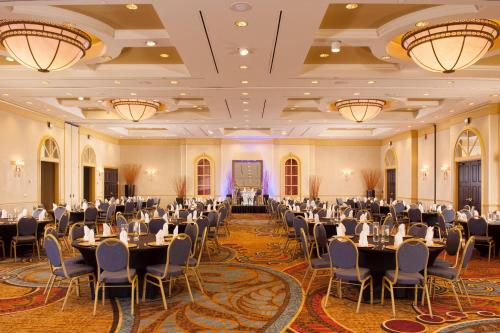 a banquet hall with tables and chairs in a ballroom at Greenville Marriott in Greenville