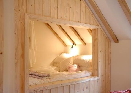 a built in bed in a room with a mirror at Manor House Stables, Martin - lovely warm cosy accommodation near Woodhall Spa in Martin