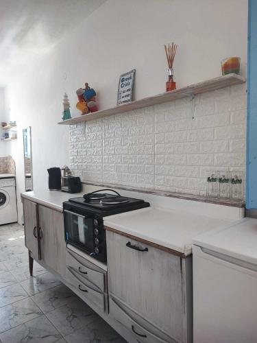 a kitchen with a stove and a counter top at Studio Lachania in Lachania