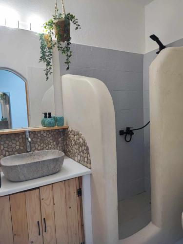 a bathroom with a sink and a shower at Studio Lachania in Lachania