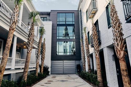 a house with palm trees in front of it at Hotel Bella Grace in Charleston