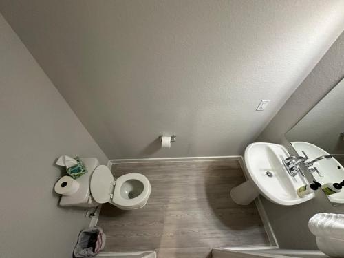a bathroom with a sink and a toilet at Beautiful spacious house with great location! in Conroe