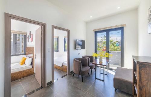 a room with a bedroom with a bed and a table at D View Apartment in Da Lat