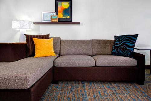 a couch with two pillows on it in a room at Residence Inn by Marriott Cleveland Mentor in Mentor