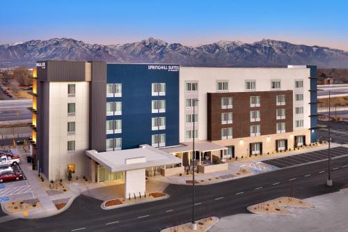 a rendering of a hotel with mountains in the background at SpringHill Suites By Marriott Salt Lake City West Valley in West Valley City