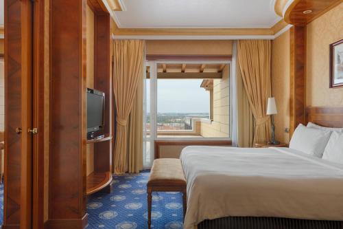 a hotel room with a bed and a large window at Rome Marriott Park Hotel in Rome