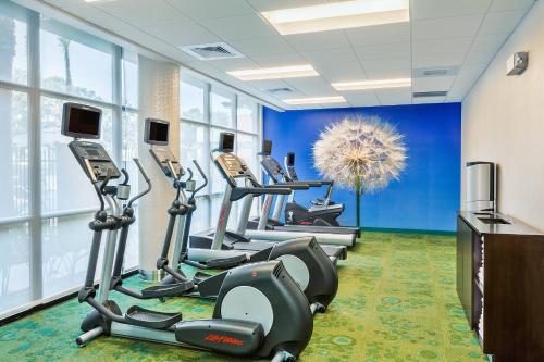 a row of treadmills in a fitness room at Springhill Suites by Marriott Anaheim Maingate in Anaheim