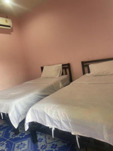 Postel nebo postele na pokoji v ubytování Yok2 Guesthouse