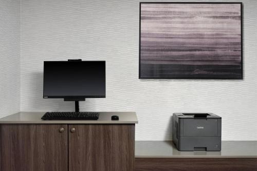 a computer sitting on top of a desk with a printer at Residence Inn Costa Mesa Newport Beach in Costa Mesa