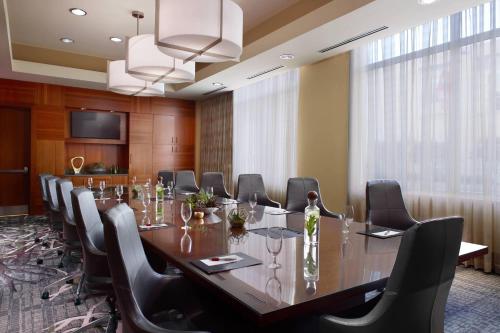 a large conference room with a long table and chairs at Raleigh Marriott City Center in Raleigh