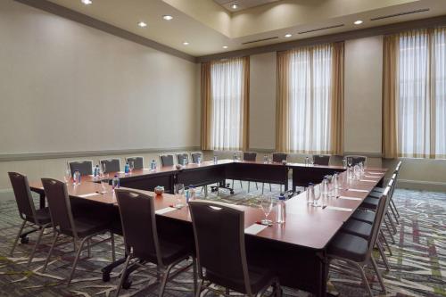a conference room with a long table and chairs at Raleigh Marriott City Center in Raleigh