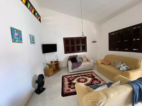 Ein Sitzbereich in der Unterkunft Casa Porto de Galinhas