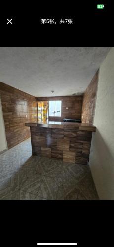 a room with a stone wall and a window at zhen in Mexico City
