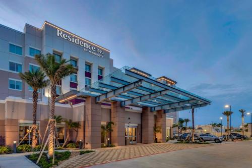 a hotel building with a blue canopy at Residence Inn by Marriott Corpus Christi Downtown in Corpus Christi