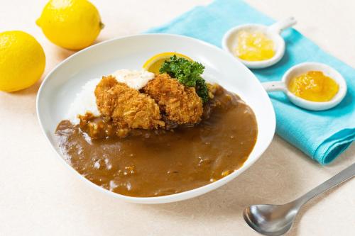 a bowl of food with meat and gravy and eggs at Vessel Inn Hiroshima Station in Hiroshima
