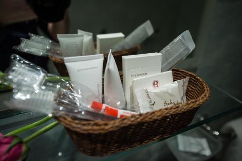 a basket filled with items on a glass table at Hotel Olympos in Pýrgos