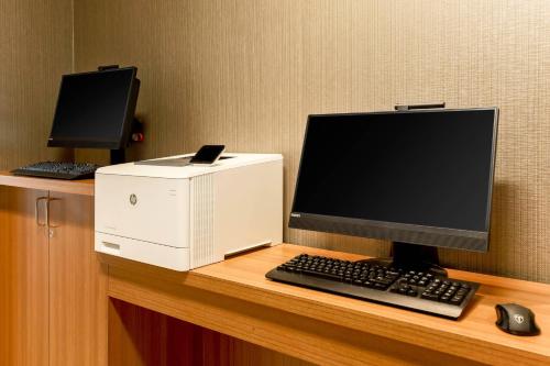 a desktop computer and a printer on a desk at SpringHill Suites by Marriott Tallahassee North in Tallahassee