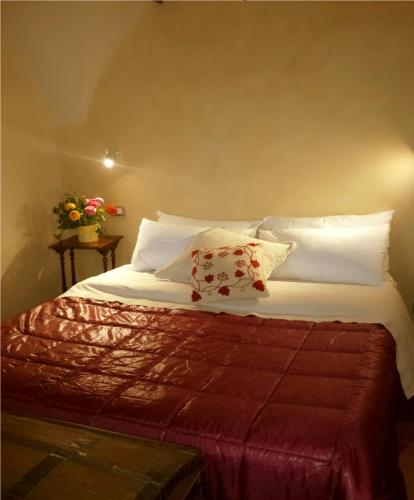a bedroom with a bed with white sheets and pillows at Villa Mont des Oliviers CITRA-8055LT-1805 e 1807 in Sanremo