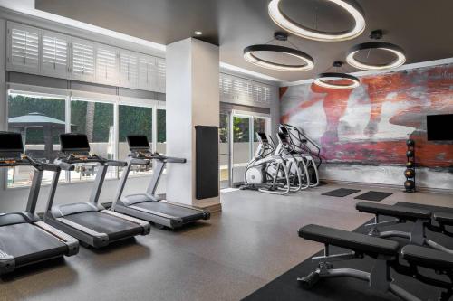 a gym with treadmills and exercise equipment in a room at San Diego Marriott Del Mar in San Diego