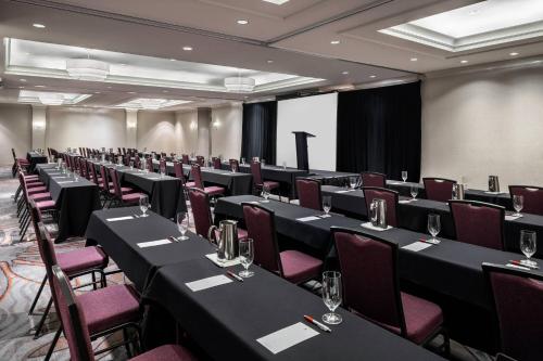 a conference room with black tables and purple chairs at San Diego Marriott Del Mar in San Diego