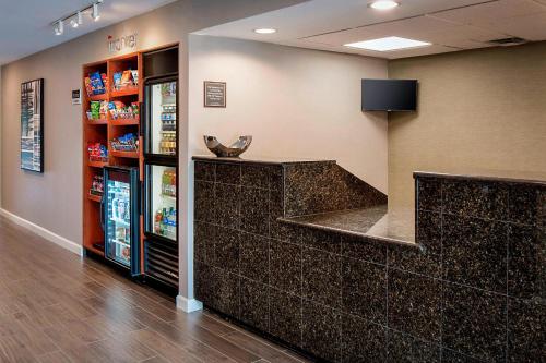 a lobby of a store with a counter and a refrigerator at Residence Inn Dallas Las Colinas in Irving