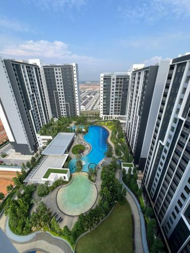 an aerial view of a resort with tall buildings at NVilla Splashmania Gamuda Cove - Mayabay Residences in Banting