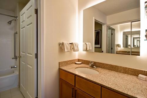 a bathroom with a sink and a mirror at Residence Inn by Marriott Dayton Beavercreek in Beavercreek