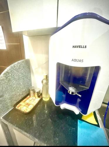 a coffee maker sitting on top of a counter at Chic Studio To Stay in South Delhi in New Delhi