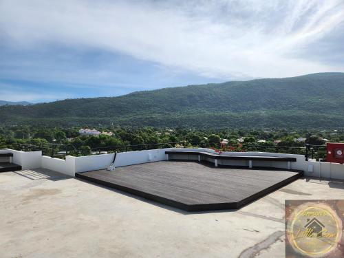a balcony with a view of a mountain at Simpson's Little Gem in Kingston