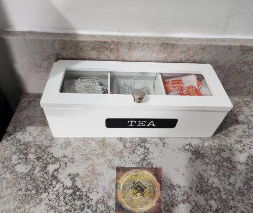 a white sink sitting on top of a counter at Simpson's Little Gem in Kingston
