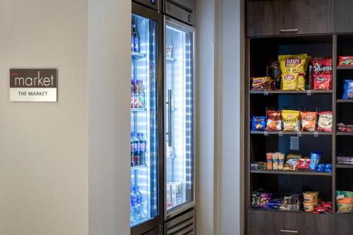 a refrigerator with its door open in a room at Residence Inn by Marriott Dallas Plano/Richardson at Coit Rd. in Plano