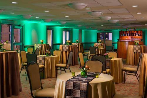 a room with tables and chairs and green walls at San Diego Marriott Gaslamp Quarter in San Diego