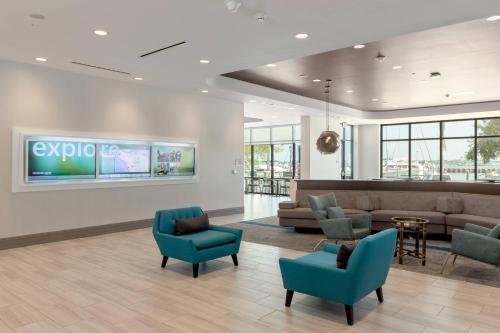 a lobby with couches and chairs and a waiting room at SpringHill Suites by Marriott Bradenton Downtown/Riverfront in Bradenton