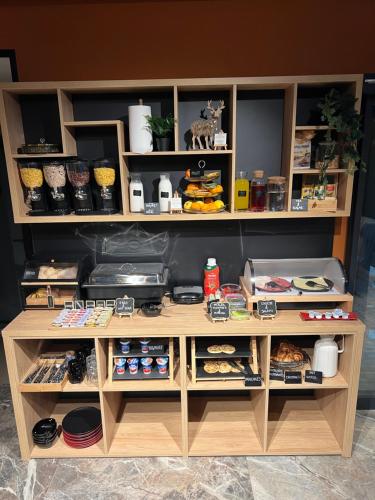 a wooden shelf with food and other items on it at Boutique hotel ZBILJE in Zbilje