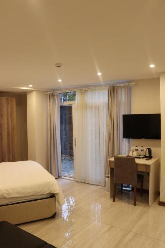 Телевизор и/или развлекательный центр в Yankı Hotel