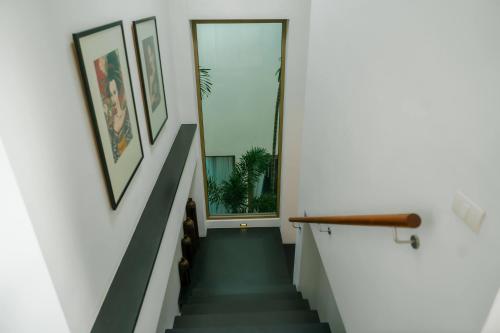 a staircase in a house with a window at Seaview Villa Near Naithon Beach Phuket in Nai Thon Beach