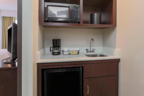 a kitchen with a sink and a microwave at SpringHill Suites by Marriott Yuma in Yuma