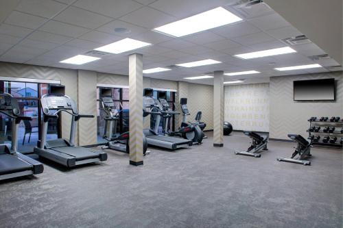 a gym with several treadmills and cardio machines at Residence Inn by Marriott Dallas Allen/Fairview in Fairview