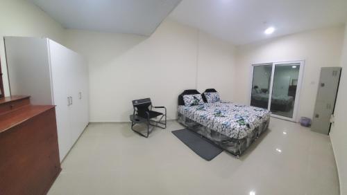 Jasmine House tesisinde bir odada yatak veya yataklar