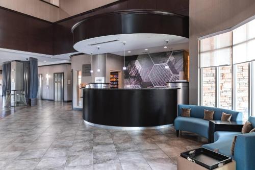 a lobby with a bar in a building at SpringHill Suites by Marriott Waco Woodway in Woodway