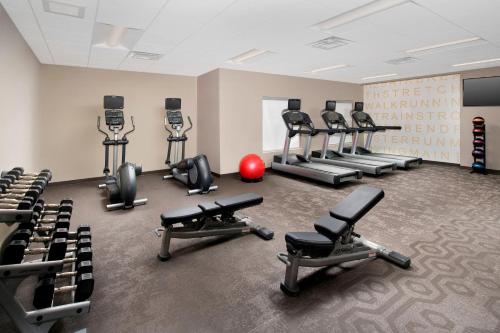 a gym with several treadmills and exercise bikes at Residence Inn by Marriott Denver Airport/Convention Center in Denver