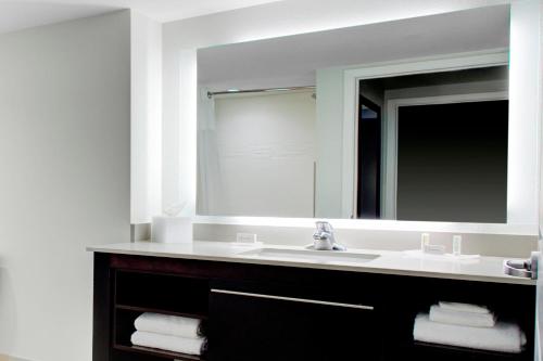 a bathroom with a sink and a mirror at Residence Inn by Marriott Boulder Broomfield/Interlocken in Broomfield
